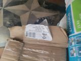a cardboard box sitting on top of a pile of boxes
