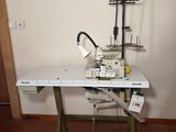 a sewing machine sitting on a table in a room