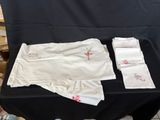 a black table with a black table cloth and white napkins on it