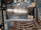 a metal container filled with a lot of metal items