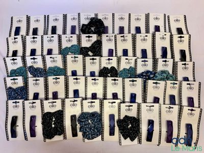 a lot of blue and black nail polishes on display