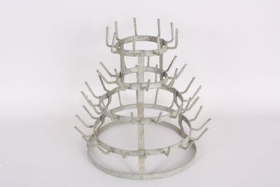 a picture of a metal wine rack on a white background