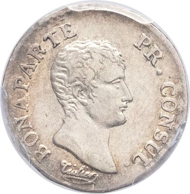 gros plan d'une pièce de monnaie sur une surface blanche avec un fond blanc