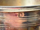 a close up of a metal container with a handle