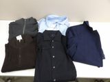 three men ' s shirts are lined up on a white table