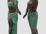 pair of antique bronze figurines of african women carrying pots