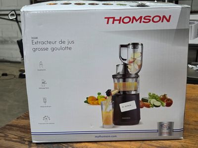 a box that has a blender in it on a table