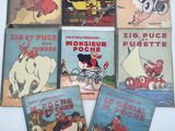six livres pour enfants dans une boîte blanche posée sur une table