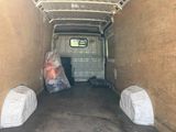 an image of a van with a lot of stuff in the back