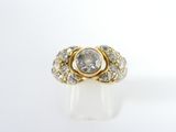 a close up of a diamond ring on a white surface