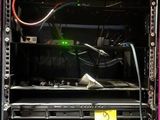 an image of a pink computer case with a green light in it