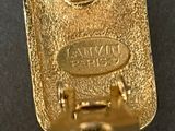 a close up of a gold plated cell phone on a table
