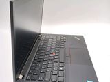 a laptop with a black keyboard sitting on a white surface