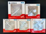 quatre boîtes de produits Airplus posées sur une table noire