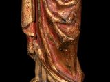 an image of a statue of a man in a robe holding a book