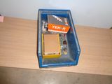 a box of tools on a table next to a wall