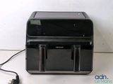a black printer sitting on top of a white table