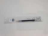 a close up of a pen sitting on top of a white table