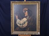 une image représentant un tableau où l'on voit une femme tenant un oiseau, posé sur un chevalet
