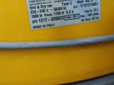 a close up of a yellow and grey bucket with a hose