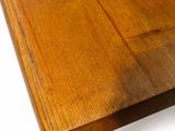 the table is made of wood and has a thick top