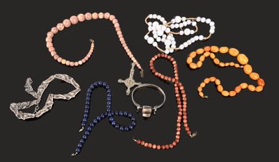 a lot of beads and bracelets on a black background
