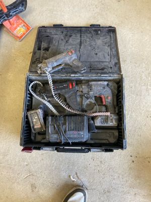 a tool box with tools on the floor next to a pair of shoes