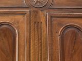 a close up of a wooden door with a clock on it
