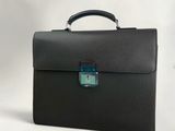 black leather briefcase with a blue lock on the handle