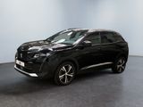 Le SUV noir est garé dans une pièce au sol gris.