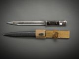 two knives that are sitting next to each other