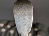 a lot of spoons that are sitting on a table