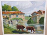 two cows standing in the water near a building