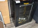 a box on top of a computer cabinet in a room