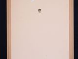 an easel with a white canvas on it and a black background