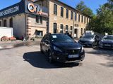 a black car parked in front of a building
