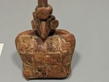an image of a small statue of a man with a hat on it ' s head