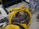a yellow blower sitting on the floor in a room
