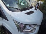 a white van that is parked on the side of the road