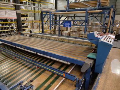 a machine that is working on a conveyor belt in a warehouse