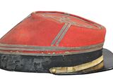 a red hat with a black band on top of it