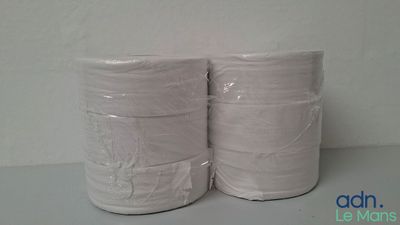 two rolls of toilet paper are stacked on top of each other