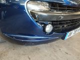 a blue car that is parked in a garage