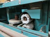 a picture of a machine that is working on a piece of machinery