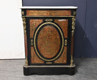 an antique black and gold painted cabinet with a marble top