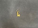 a small key that is sitting on a table