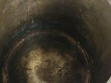 a metal bowl that is sitting on a table