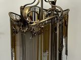 a chandelier hanging from the ceiling in a room