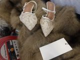 a pair of shoes that are on top of a fur
