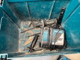 a blue box with tools inside of it on the floor